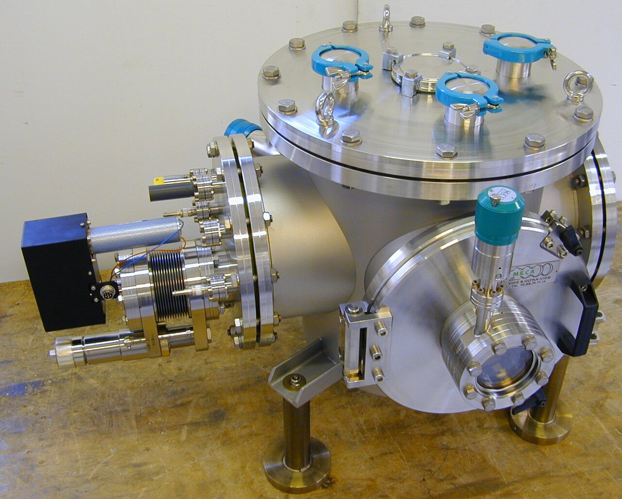 Plasma deposition chamber in operation &mdash; representative of the high-vacuum plasma-driven deposition environments that AtOMS optical sensors monitor.